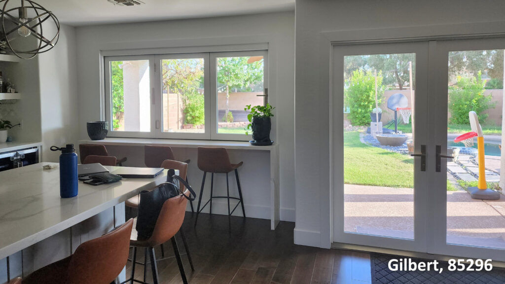 Weather Shield Bi-Folding Passthrough Kitchen Window and Vinyl Desert Mountain French Door in Stucco Home in Gilbert, AZ 85296